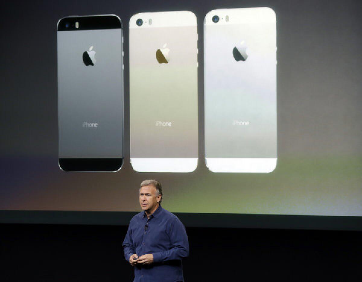 Phil Schiller, Apple's senior vice president of worldwide product marketing, speaks on stage during the introduction of the new iPhone 5s in Cupertino, Calif.