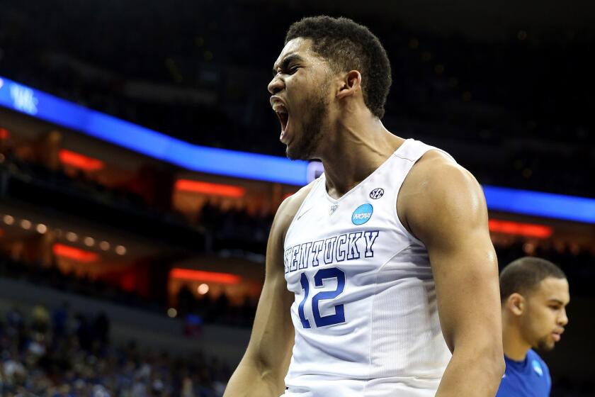 Kentucky forward Karl-Anthony Towns celebrates after a basket against Hampton during a 79-56 victory in the NCAA tournament on Thursday night.