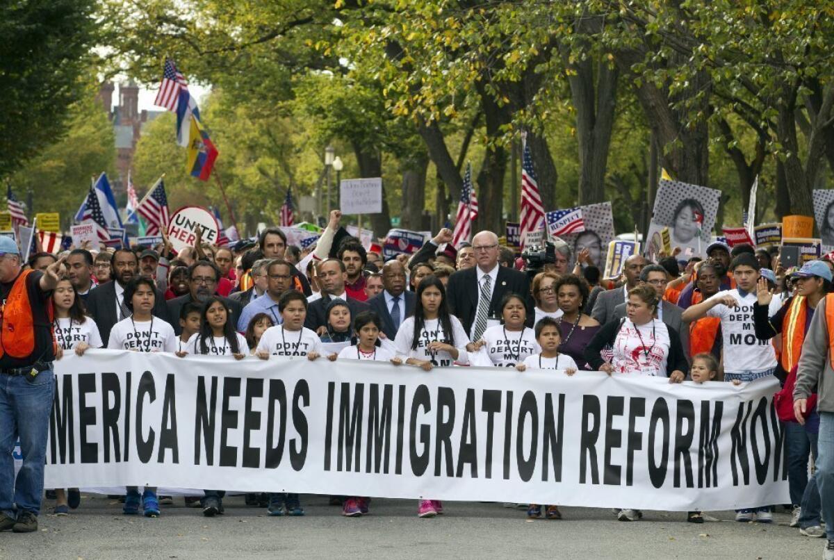 Demonstrators march toward Capitol Hill during a immigration rally in Washington on Oct. 8 seeking to push Republicans to hold a vote on a stalled immigration reform bill.