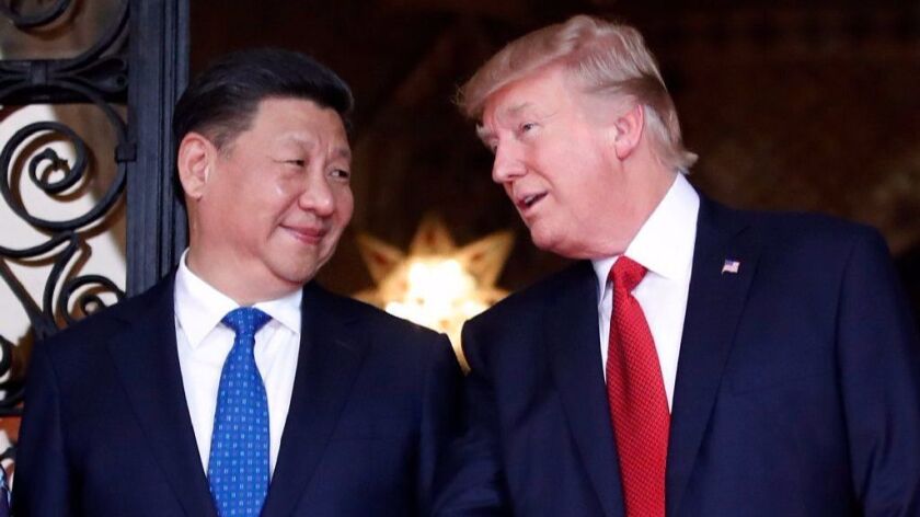 Chinese President Xi Jinping and President Trump pose together before dinner in April at Trump's Mar-a-Lago compound in Palm Beach.