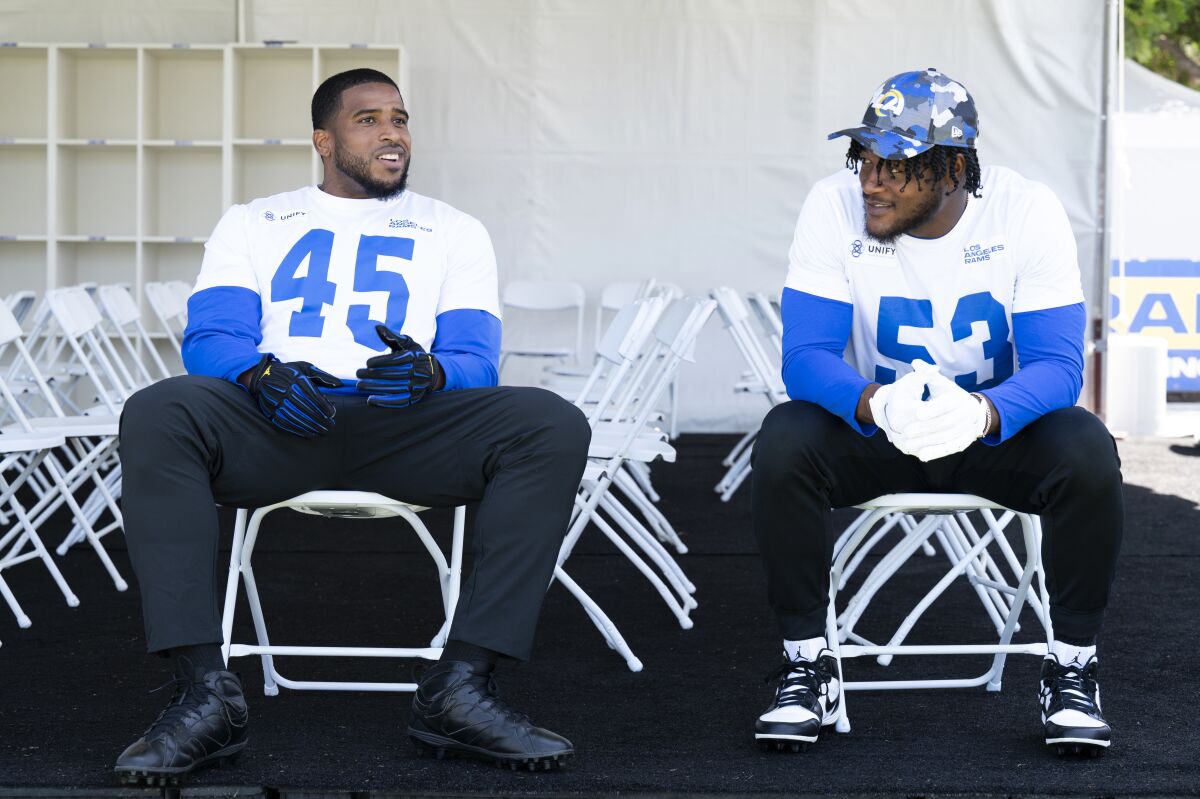 Los Angeles Rams linebacker Bobby Wagner chats with linebacker Ernest Jones during NFL football practice Tuesday, July 26, 2022, in Irvine, Calif. (AP Photo/Kyusung Gong)