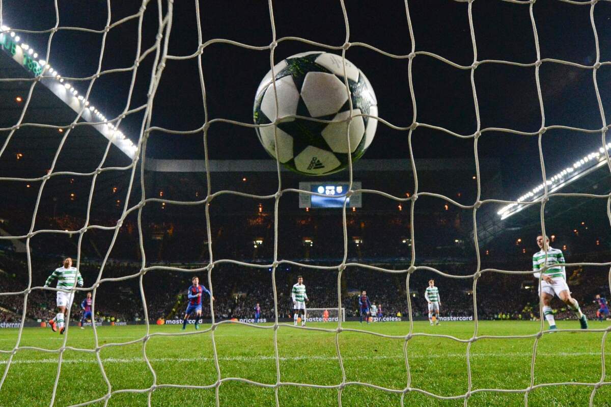 The ball slams into the back of the net after Barcelona's Argentinian striker Lionel Messi (unseen) scored a penalty for Barcelona's second goal during the UEFA Champions League group C football match between Celtic and Barcelona at Celtic Park in Glasgow on November 23, 2016. / AFP PHOTO / Paul ELLISPAUL ELLIS/AFP/Getty Images ** OUTS - ELSENT, FPG, CM - OUTS * NM, PH, VA if sourced by CT, LA or MoD **