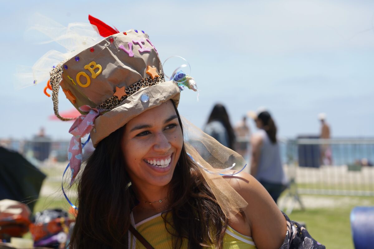 Ashley Andrade created paper hats from bags at the Rad Hatter booth.
