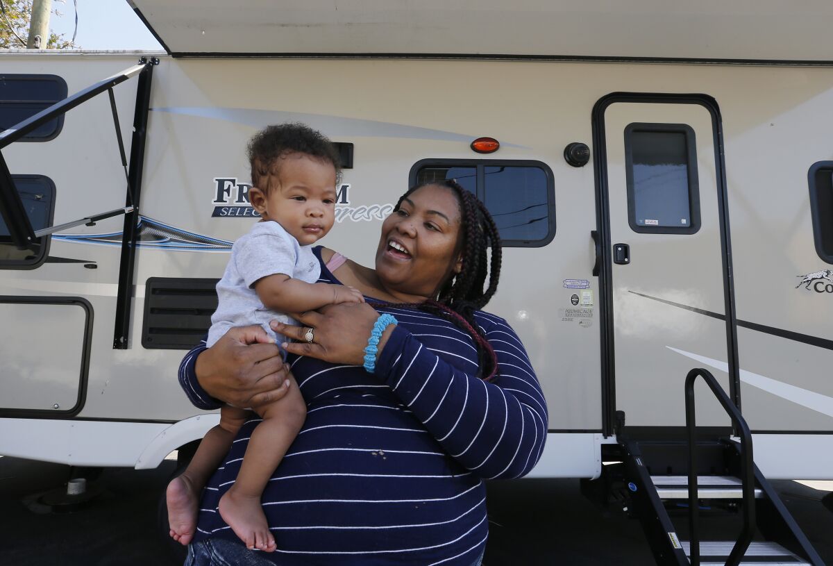 Nicole Bradley-Bibb lives with her two children, including a toddler named Dallas, at a South Los Angeles trailer shelter.