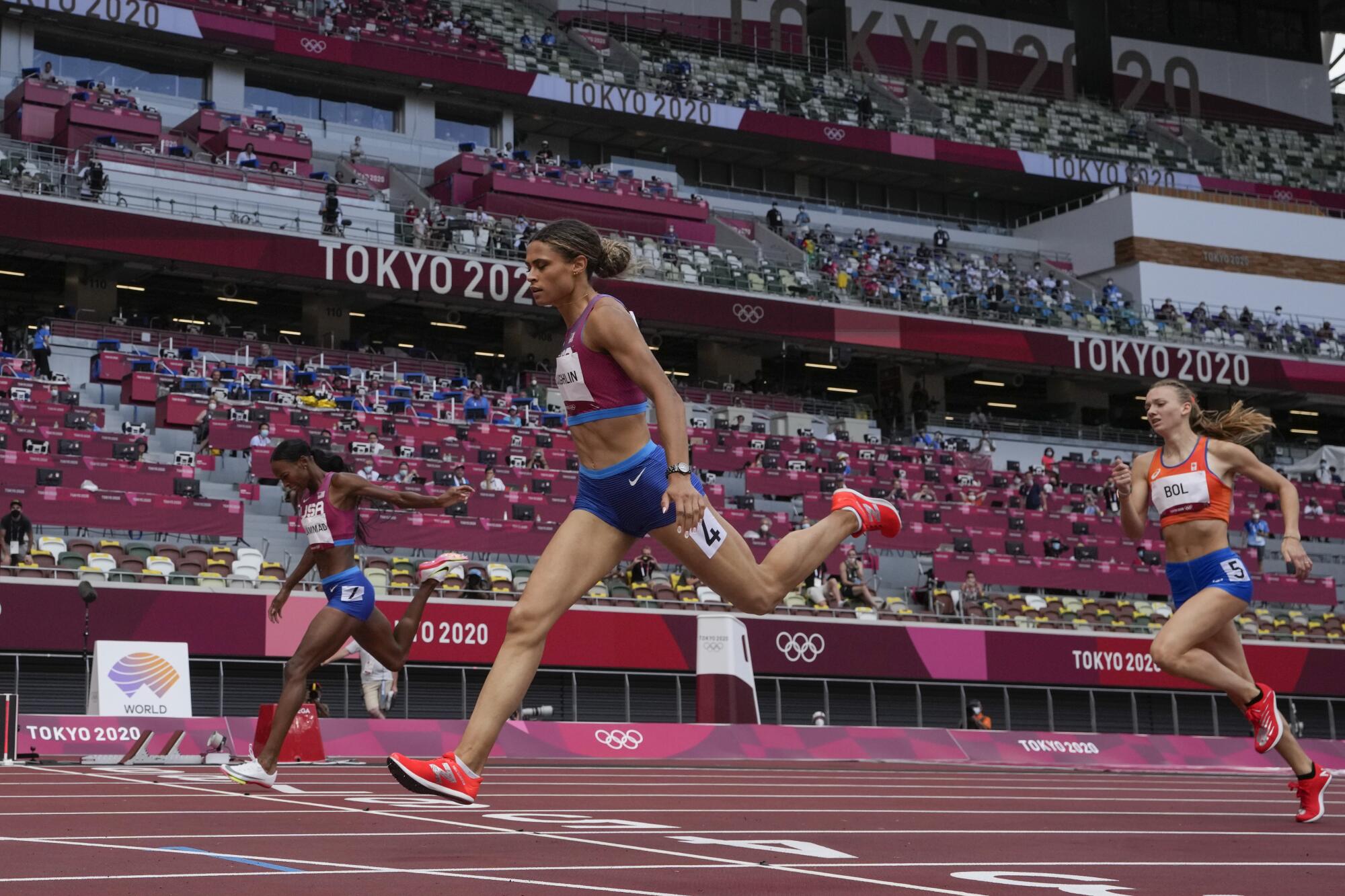 Sydney McLaughlin crosses the finish line to win the 400-meter race at the Tokyo Olympics.