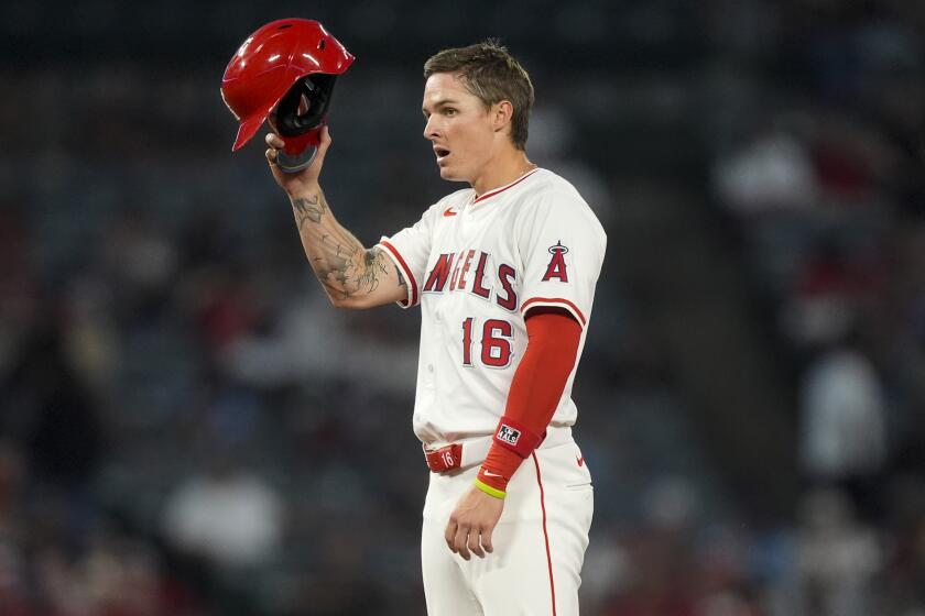 Los Angeles Angels' Mickey Moniak gestures after advancing to second on a wild pitch by Oakland Athletics starting pitcher Mitch Spence during the sixth inning of a baseball game Tuesday, June 25, 2024, in Anaheim, Calif. (AP Photo/Ryan Sun)