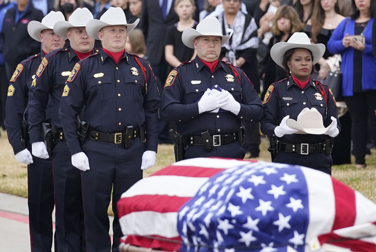 Harris County Constable Precinct 5 honor guard members stand by the casket of Pct. 5 Cpl. Charles Galloway during a service outside the Second Baptist Church West Campus in Houston on Tuesday, Feb. 1, 2022. Galloway was fatally shot during a traffic stop in southwest Houston on Jan. 23. (Melissa Phillip/Houston Chronicle via AP)