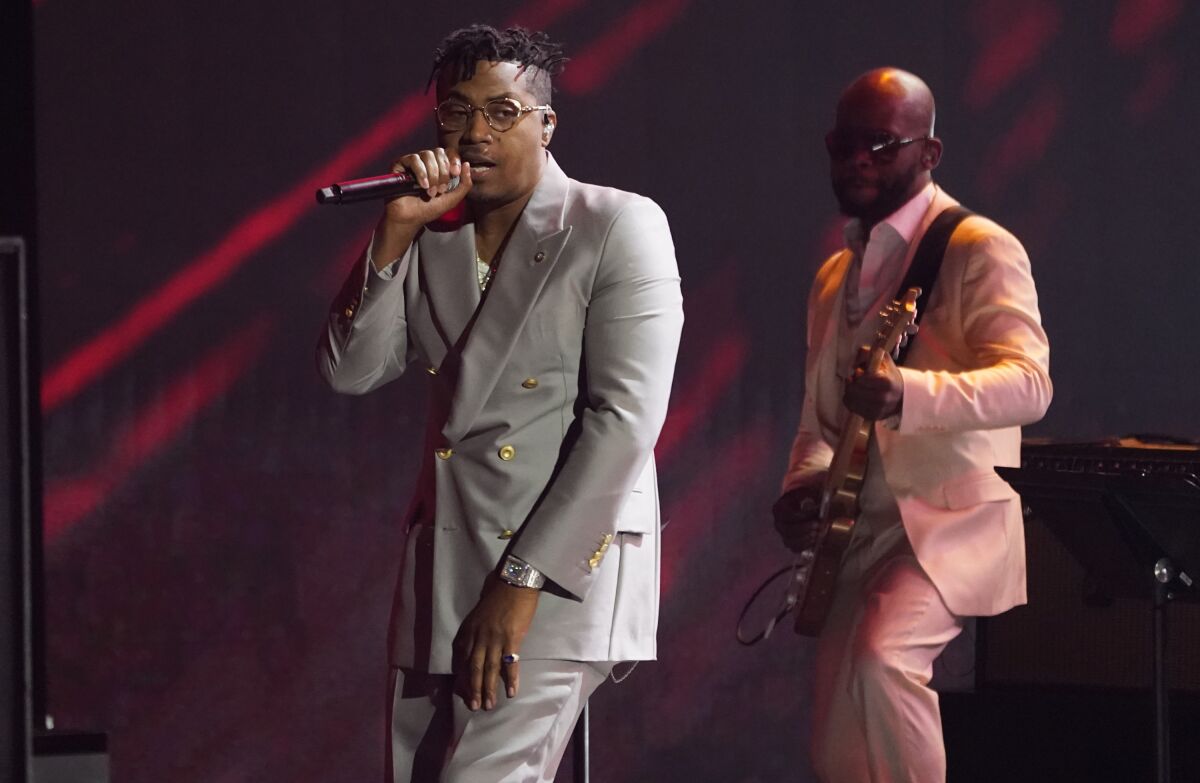 Nas, left, performs a medley at the 64th Annual Grammy Awards on Sunday, April 3, 2022.