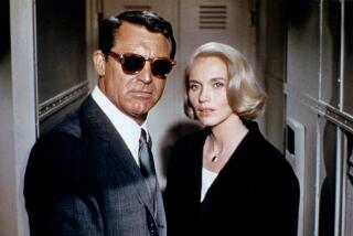Cary Grant and Eva Marie Saint on the set of Alfred Hitchcock's "North by Northwest" in 1959.
