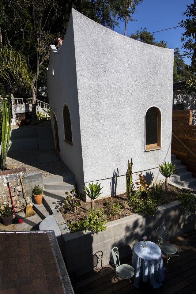 From her steep hillside, Rosenthal can peek over the house and see downtown Los Angeles.
