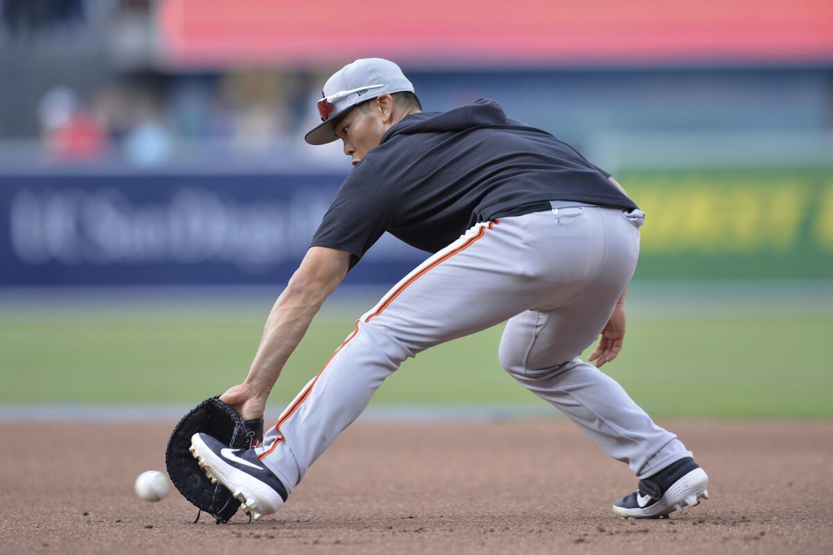 San Francisco Giants' Connor Joe fields a ground ball during batting practice in 2019.