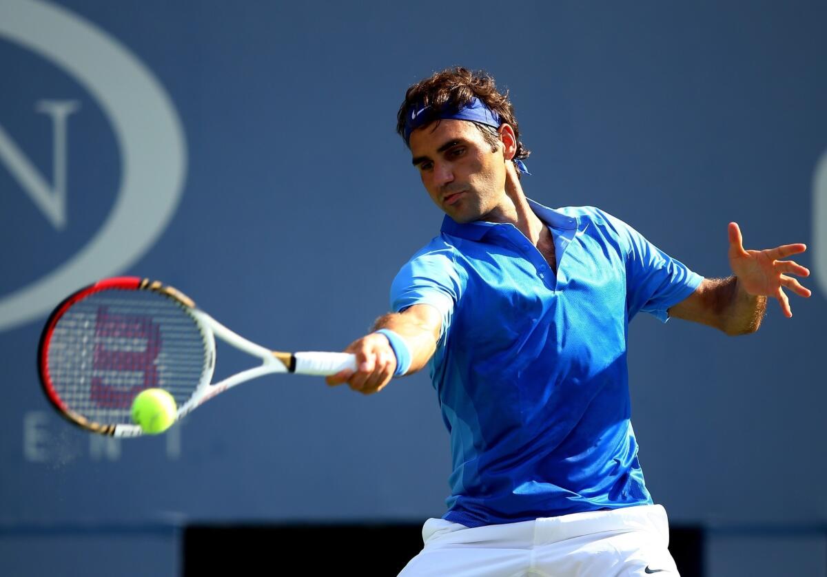 Roger Federer returns a shot during his first-round victory over Grega Zemlja at the U.S. Open on Tuesday.