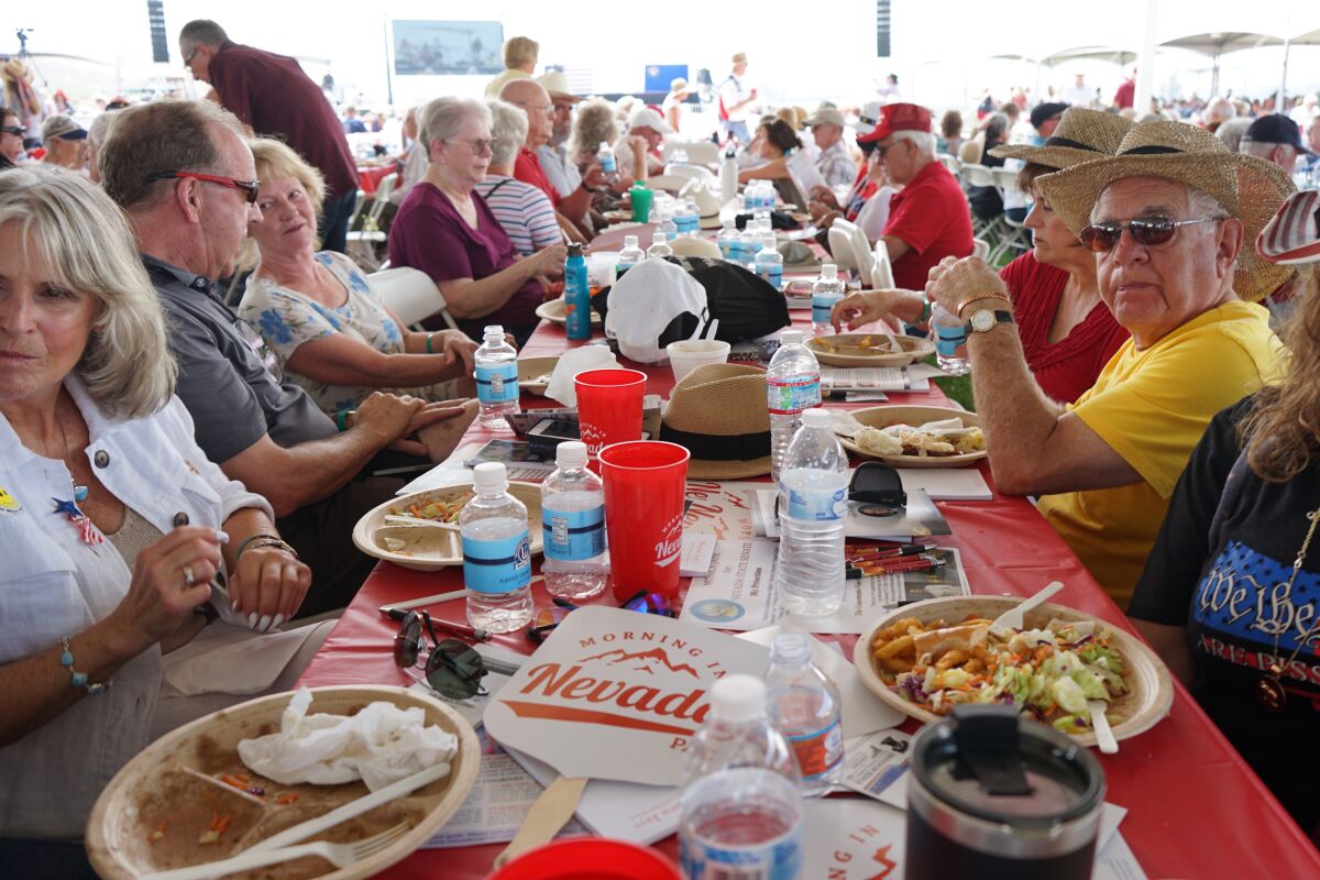 People attend the Morning in Nevada PAC's Basque Fry at Corley Ranch, Saturday, Aug. 14, 2021, in Gardnerville, Nev. U.S. Sen. Tom Cotton told a crowd of about 4,000 Nevada Republicans that Adam Laxalt planned to run for the U.S. Senate against Democrat Catherine Cortez Masto. (AP Photo/Sam Metz)