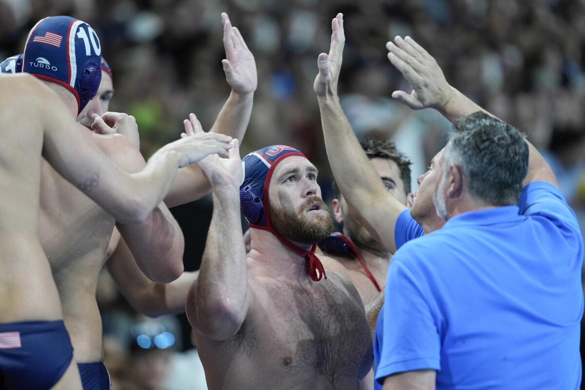 Alex Bowen of the U.S. celebrates with his teammates at the end of Monday's win.