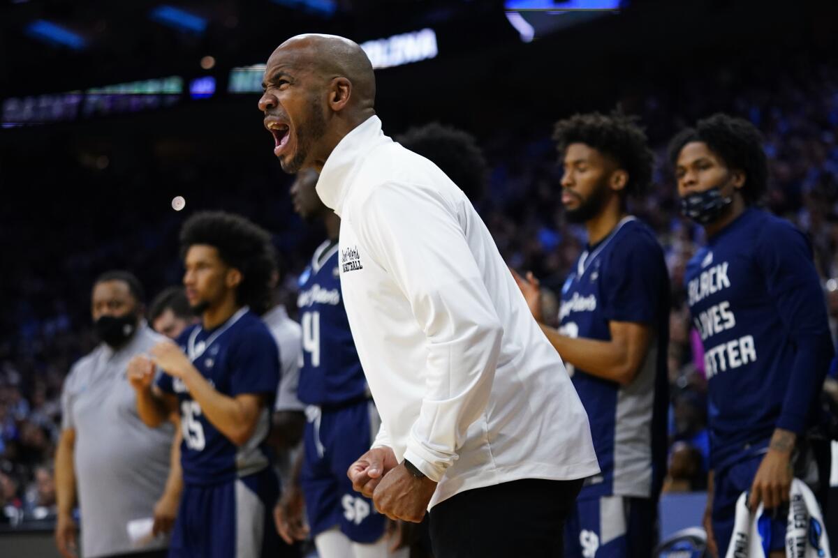 Saint Peter's coach Shaheen Holloway reacts during the first half of Sunday's loss to North Carolina.