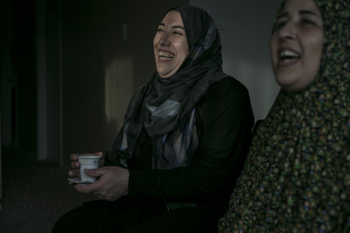 Nabiha Andani, 38, left, and Rana Al Kard, 38, talk about their lives as Syrian refugees in San Diego County.