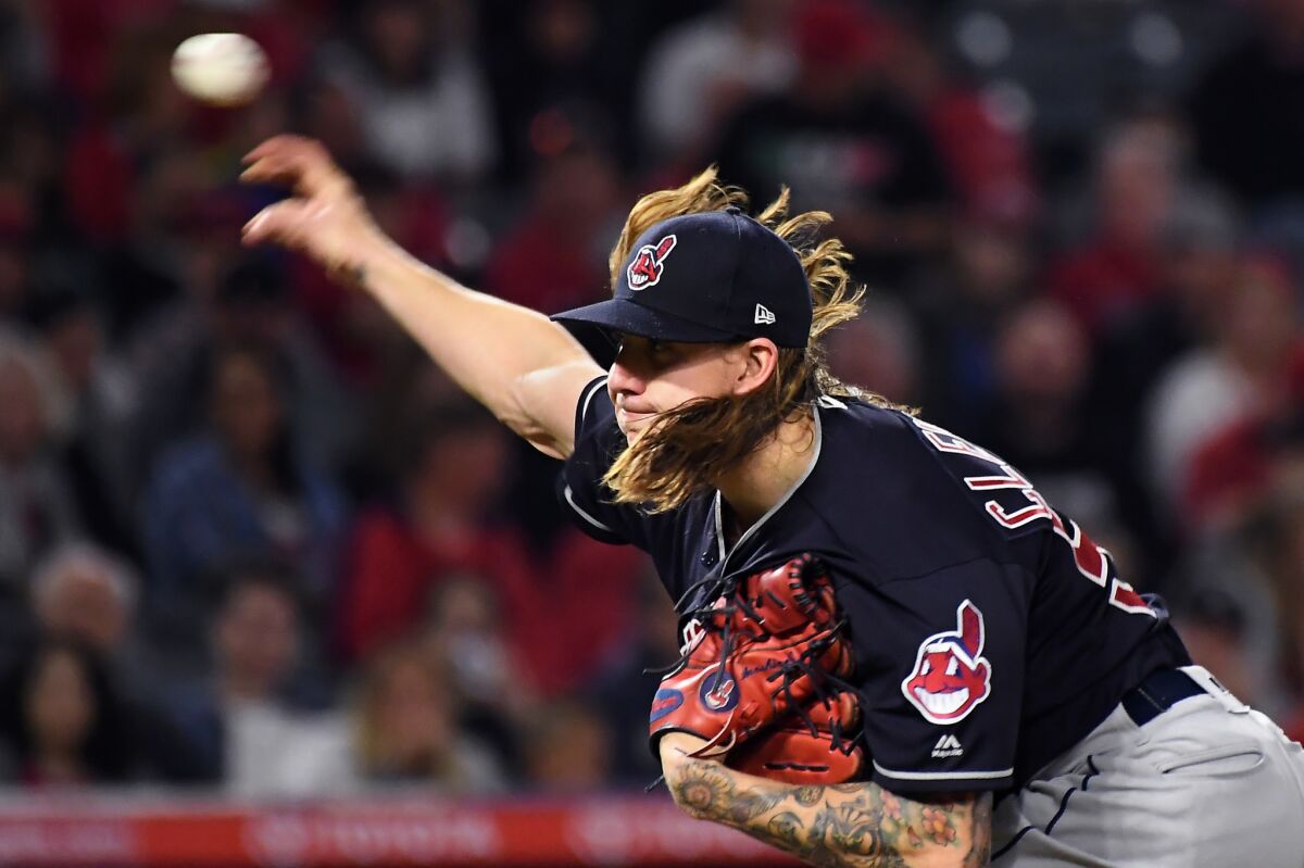 Indians pitcher Mike Clevinger throws a pitch against the Angels int he 4th inning.