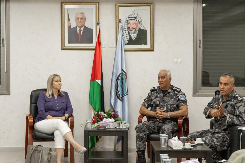 Tammy Gillies, ADL San Diego Regional Director and author of the piece, is seated on the left. On the right is Colonel Zahar Shahaab of the Palestinian College of Police Sciences in Jericho.