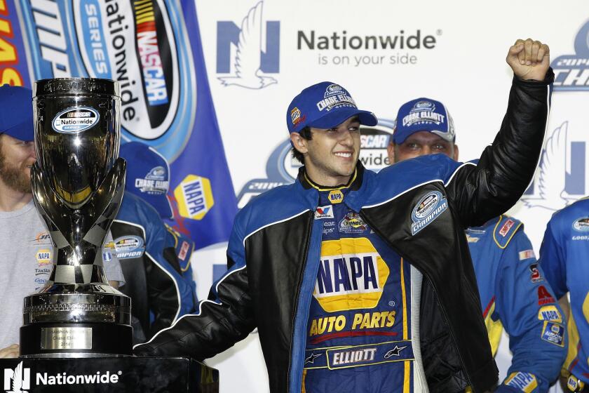 Chase Elliott celebrates in November after winning the NASCAR Nationwide series championship in Homestead, Fla.