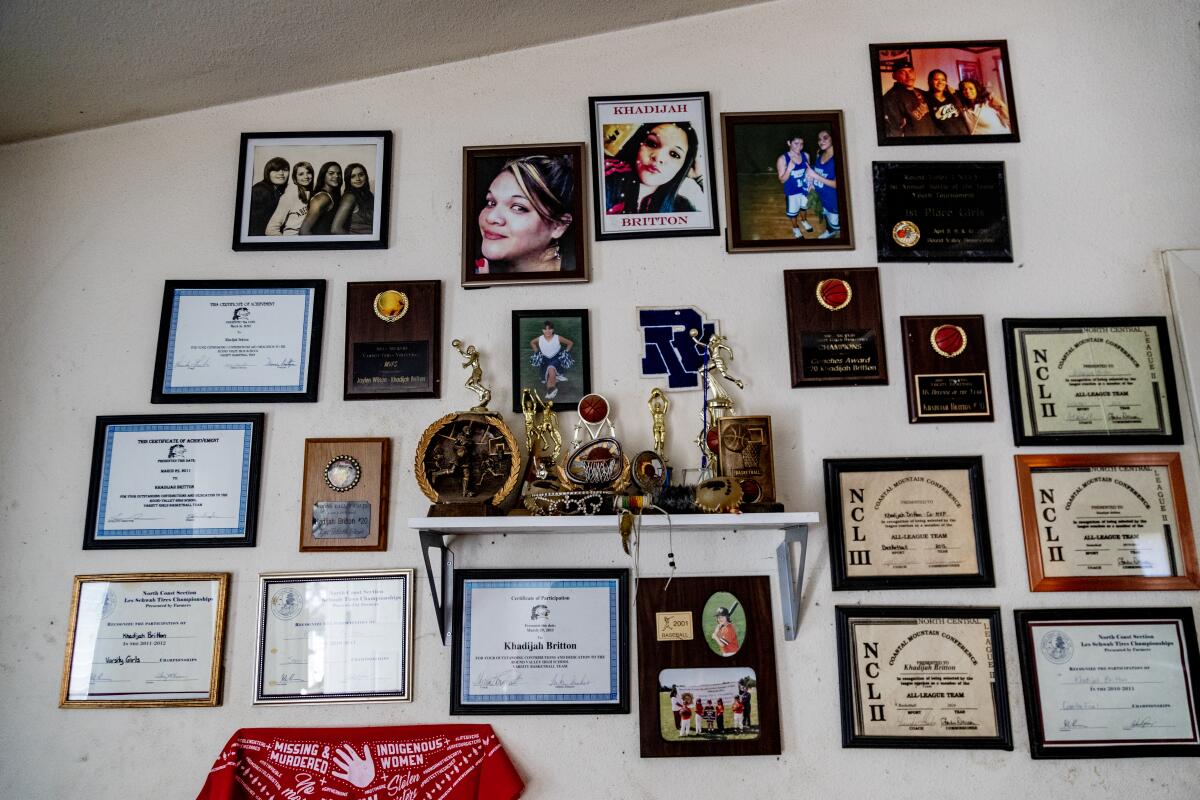 A wall in the Brittons' home is filled with high school awards of Khadijah Britton, 23, who went missing in February 2018.