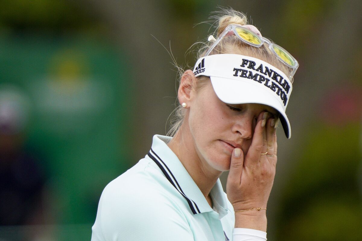 Jessica Korda reacts after missing her putt on the 18th hole during the first round of the LPGA Pelican Women's Championship golf tournament at Pelican Golf Club, Thursday, Nov. 11, 2021, in Belleair, Fla. (Martha Asencio-Rhine/Tampa Bay Times via AP)