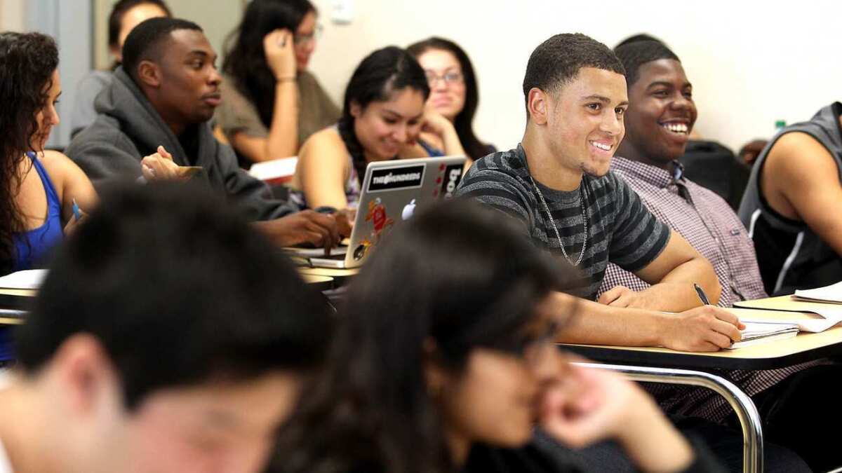Roommates Jeffrey MacGillivray, center, and Randall Jenkins, right, both 20, enjoy their philosophy class at El Camino College in Torrance.
