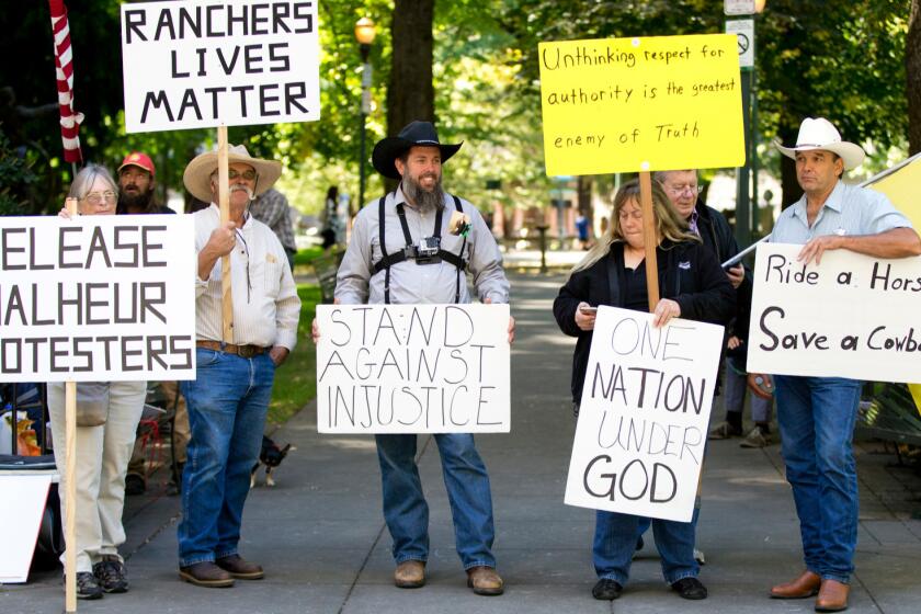 Supporters of Ammon Bundy, on trial after occupying a federal nature reserve, protest outside the federal courthouse in Portland, Ore.