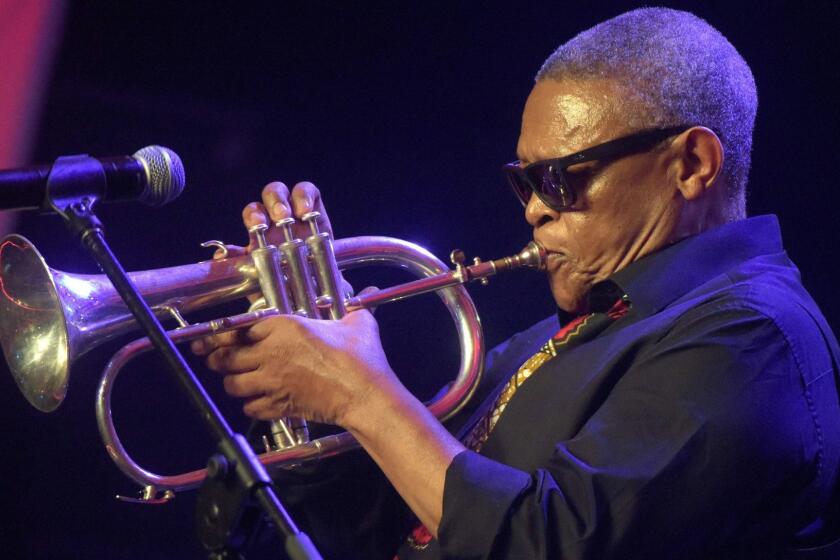 (FILES) This file photo taken on January 8, 2015 shows South African trumpeter, composer, and singer Hugh Masekela entertaining guests during the CAF African Footballer of the Year Award in Lagos. South African jazz legend Hugh Masekela has died aged 78, his family announced on January 23, 2018, triggering an outpouring of tributes to his music, his long career and his anti-apartheid activism. / AFP PHOTO / PIUS UTOMI EKPEIPIUS UTOMI EKPEI/AFP/Getty Images ** OUTS - ELSENT, FPG, CM - OUTS * NM, PH, VA if sourced by CT, LA or MoD **