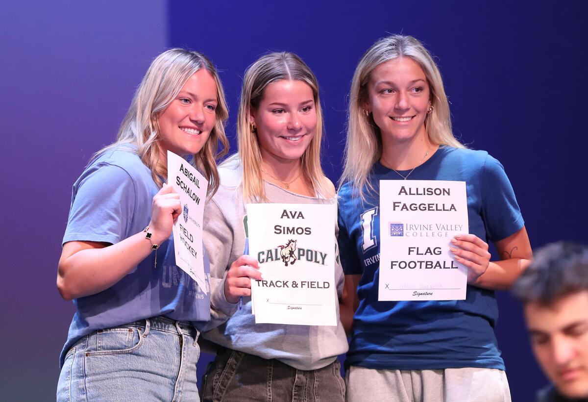 Abigail Schalow, Ava Simos and Allison Faggella, from left, gather for group pictures.