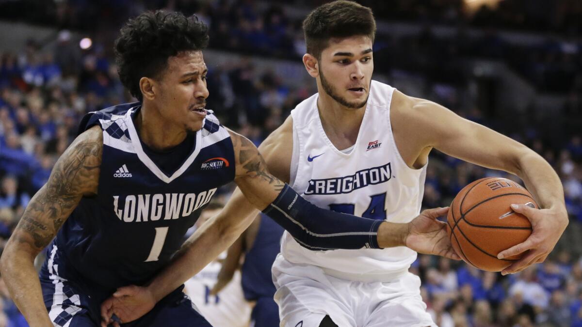 Creighton guard Kobe Paras is defended by Longwood guard Isaiah Walton (1) during a game last season.