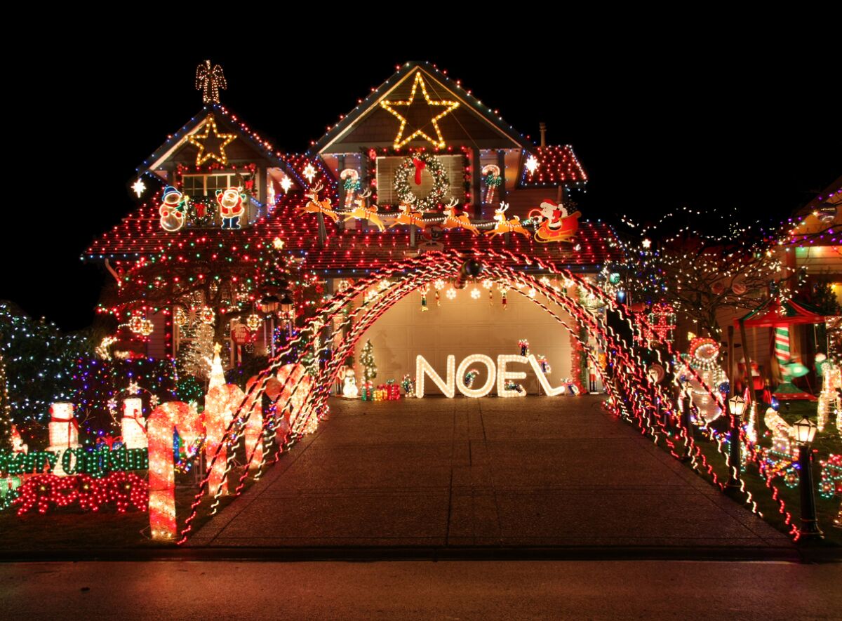A house with many Christmas decorations and lights