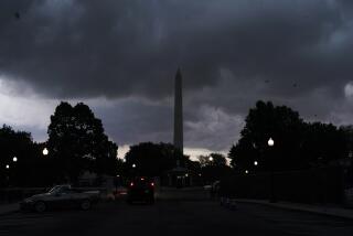 Storm clouds pass over the Washington Monument, Monday, Aug. 7, 2023, in Washington. Thousands of federal employees were sent home early Monday as the Washington area faced a looming forecast for destructively strong storms, including tornadoes, hail and lightning. (AP Photo/Jacquelyn Martin)