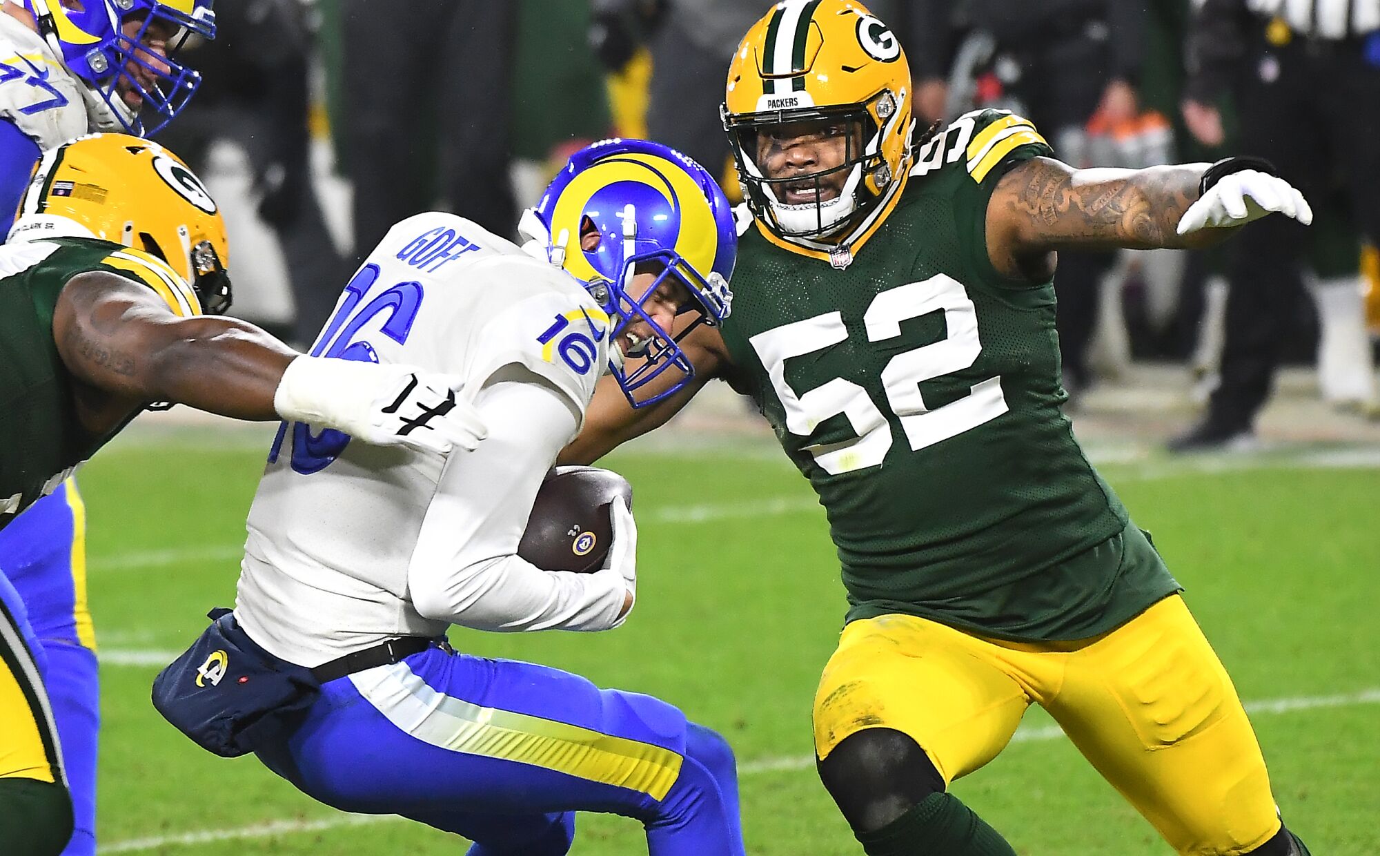 Rams quarterback Jared Goff is sacked by Packers defensive lineman Kenny Clark and linebacker Rashan Gary.