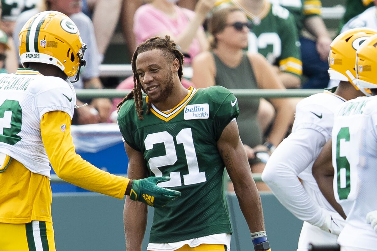 Green Bay Packers cornerback Eric Stokes (21) talks with teammates during NFL football training camp, Thursday, Aug. 5, 2021, in Green Bay, Wis. (Samantha Madar/The Post-Crescent via AP)