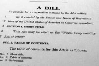 The draft of a bill that President Joe Biden and House Speaker Kevin McCarthy of Calif., negotiated to raise the nation's debt ceiling, is photographed Monday, May 29, 2023. (AP Photo/Jon Elswick)