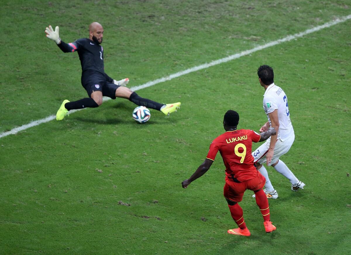 Goalkeeper Tim Howard of the USA saves a shot by Romelu Lukaku during the round of 16 match between Belgium and the USA.