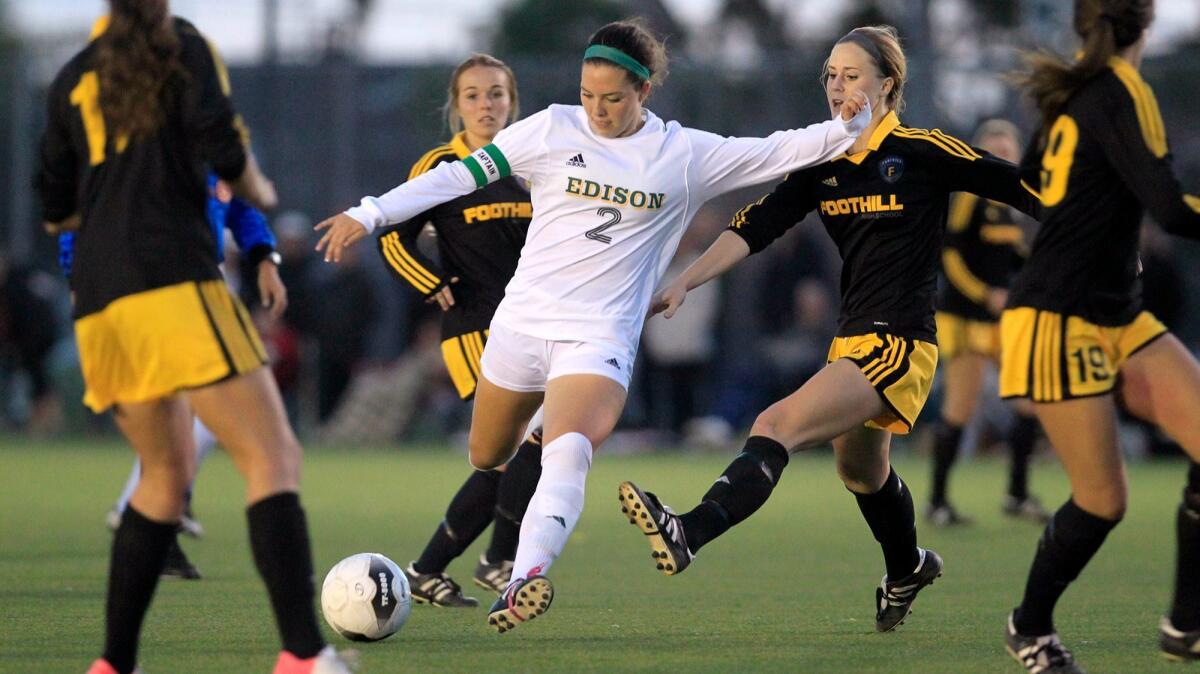 MacKenzie Cerda, shown competing as a senior at Edison High on March 4, 2014, is a senior defender for the NCAA finalist UCLA women's soccer team.