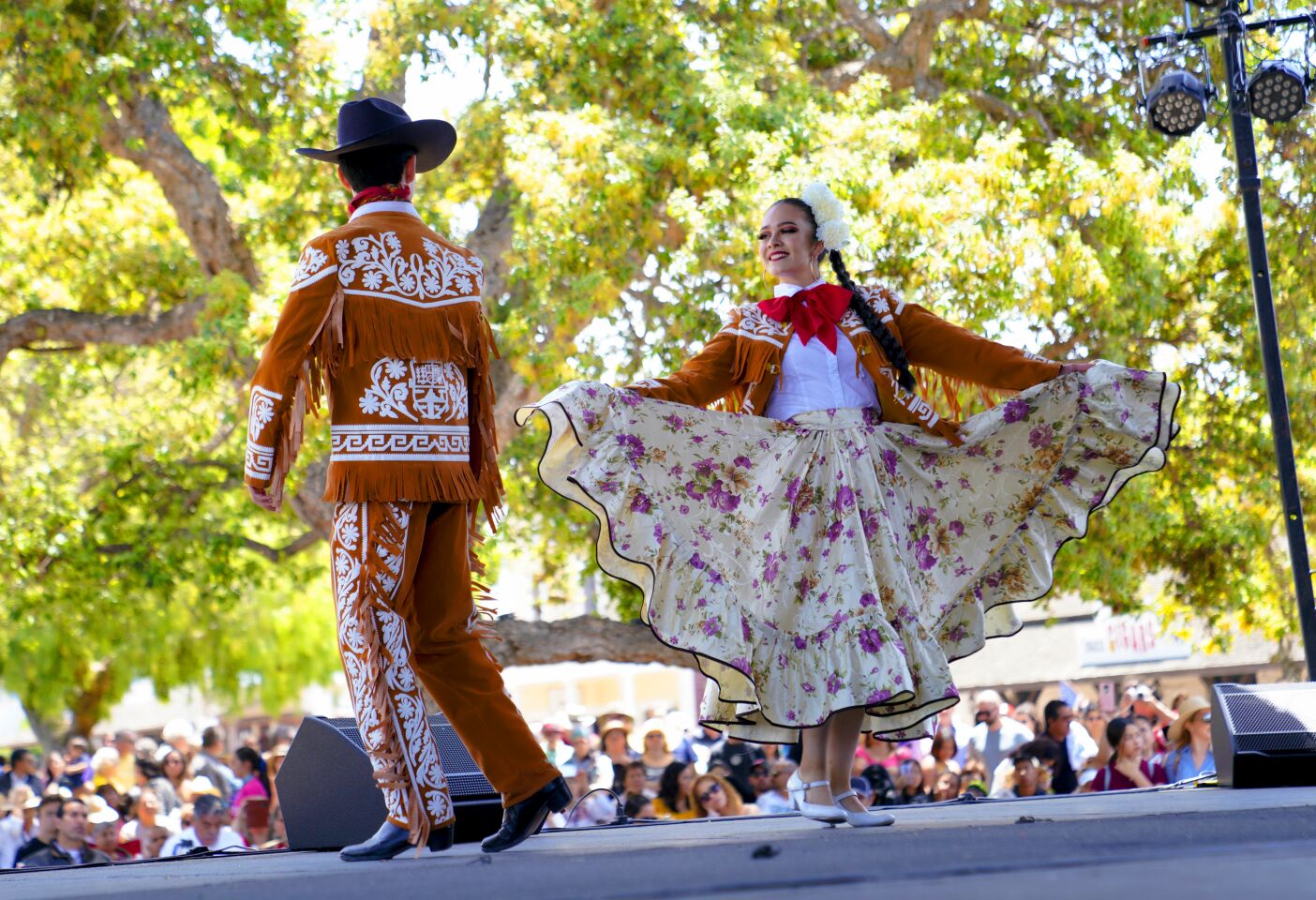 Mariana Perezchica and Jorge Romero from the group "Ballet Folklorico Coreografico Ti-Pai" from Chula Vista compete on stage in the Folklorico Festival during the Cinco de Mayo celebration on Sunday at Old Town in San Diego.