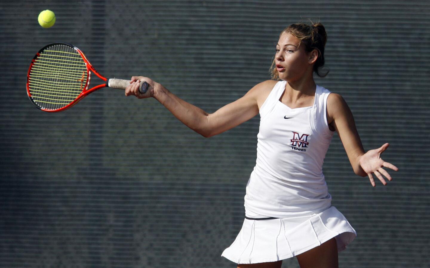 Maranatha's Hailey McNall swings at the ball during a singles match against North at Occidental College in Los Angeles on Friday, November 2, 2012.