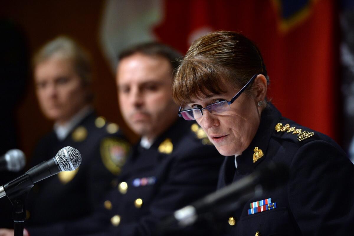 Royal Canadian Mounted Police Chief Supt. Jennifer Strachan announces an arrest Tuesday and charges against three men related to an Islamic State recruiting cell.