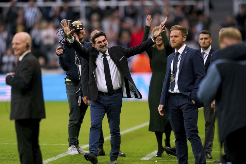 Newcastle chairman Yasir Al-Rumayyan on the pitch at half-time during the English Premier League soccer match between Newcastle United and Leicester City at St. James' Park, Newcastle upon Tyne, England, Monday, May 22, 2023. (Owen Humphreys/PA via AP)