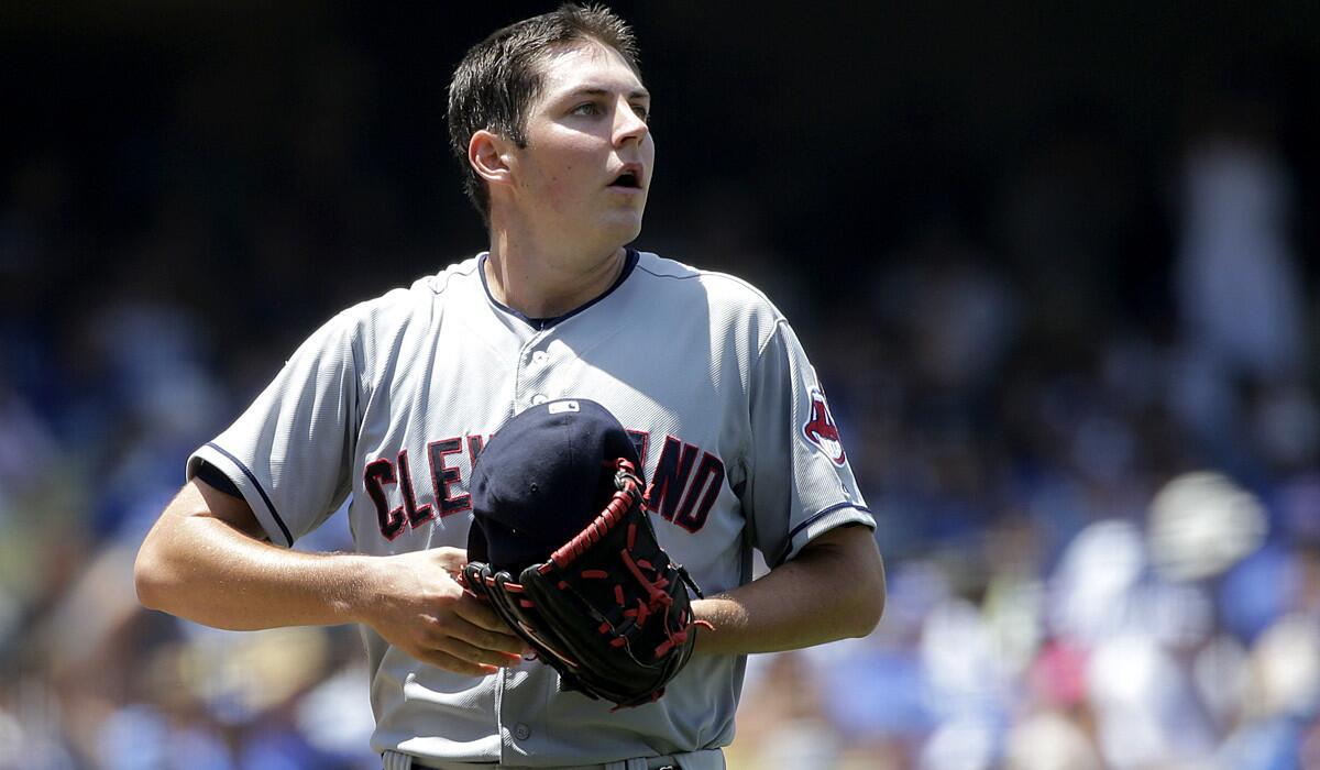 Indians starting pitcher Trevor Bauer checks the scoreboard during a rough fifth inning against the Dodgers on Wednesday afternoon.