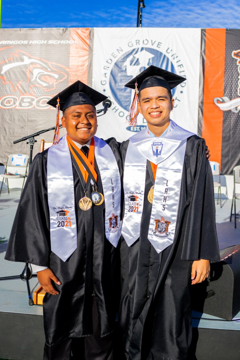 Los Amigos co-valedictorians Sebastian Lozano, left, and Kenny Tu Dao