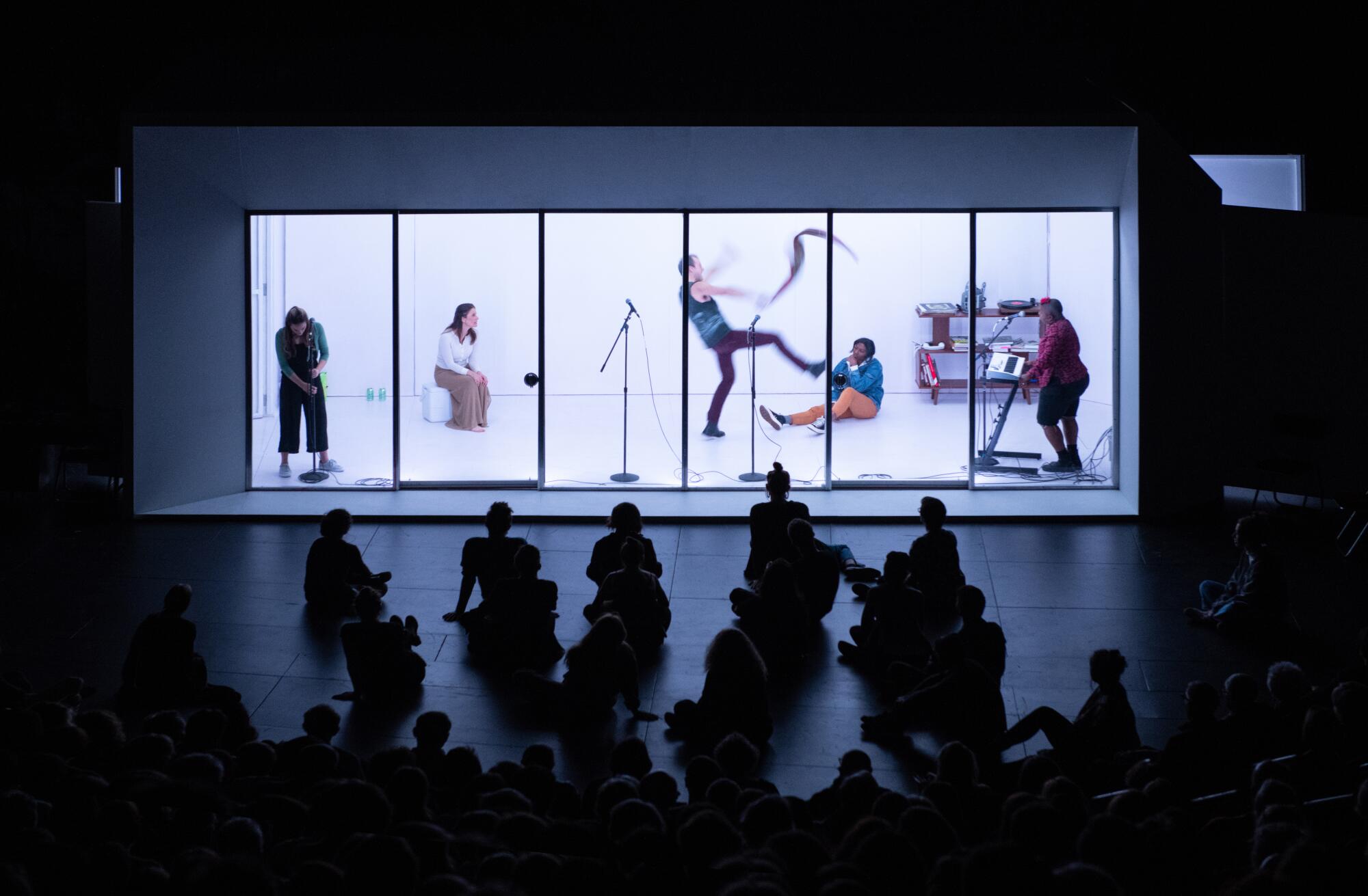 A scene from Lars Jan's "The White Album," which put 25 performers in an unventilated box.