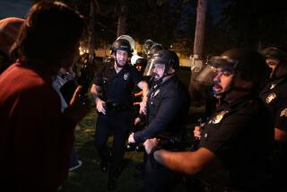 LOS ANGELES, CALIFORNIA - APRIL 24: LAPD officers try to clear the USC campus as a demonstration against the war in in Gaza went into the late Wednesday on the USC campus. (Wally Skalij/Los Angeles Times)