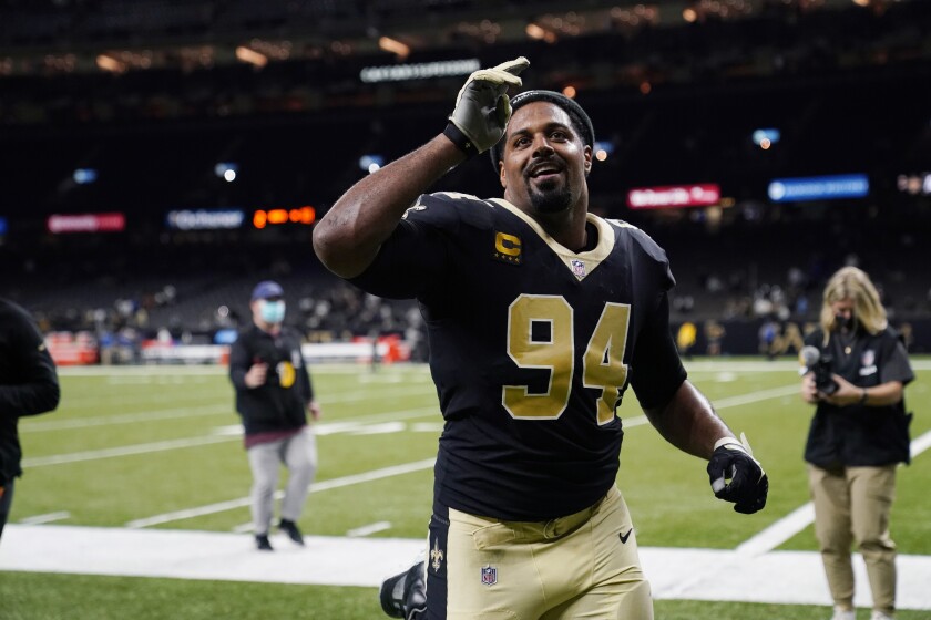 New Orleans Saints defensive end Cameron Jordan (94) celebrates as he walks off the field after an NFL football game against the Carolina Panthers in New Orleans, Sunday, Jan. 2, 2022. The Saints won 18-10. (AP Photo/Derick Hingle)