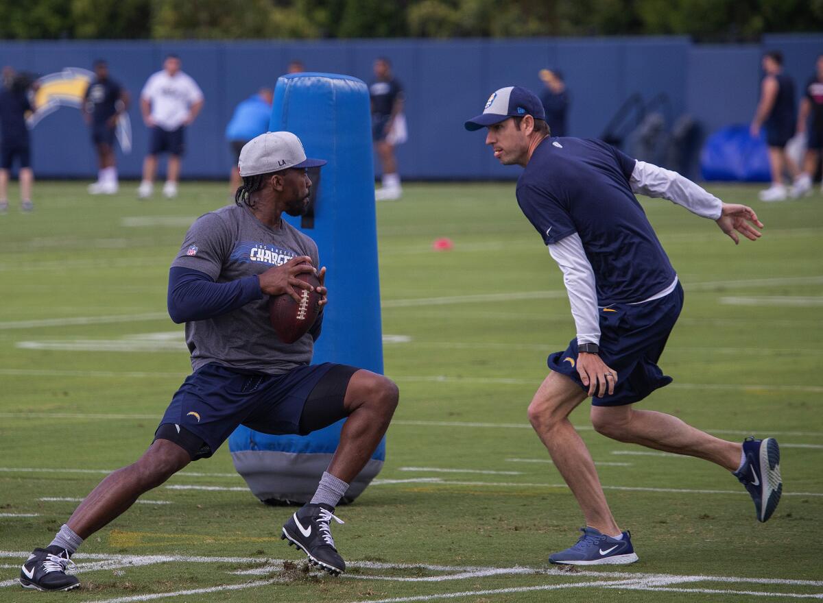Signed last season to back up Philip Rivers, Tyrod Taylor (left) is the  most experienced quarterback remaining on the Chargers' roster. 