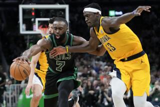 Boston Celtics guard Jaylen Brown (7) is defended by Indiana Pacers forward Pascal Siakam.