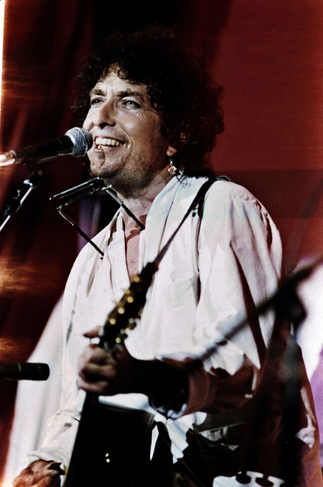Bob Dylan performs at the John F Kennedy Stadium in Philadelphia during the first international live aid concert against hunger in Africa on July 13, 1985.