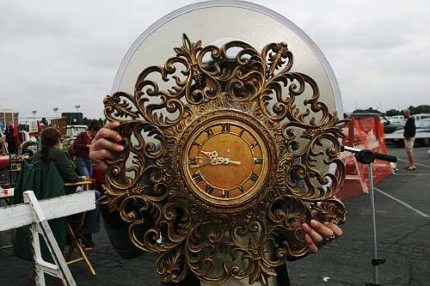 JUST IN TIME: Tokyo antiques dealer Sugi Satoshi finds an ornate clock for $20.